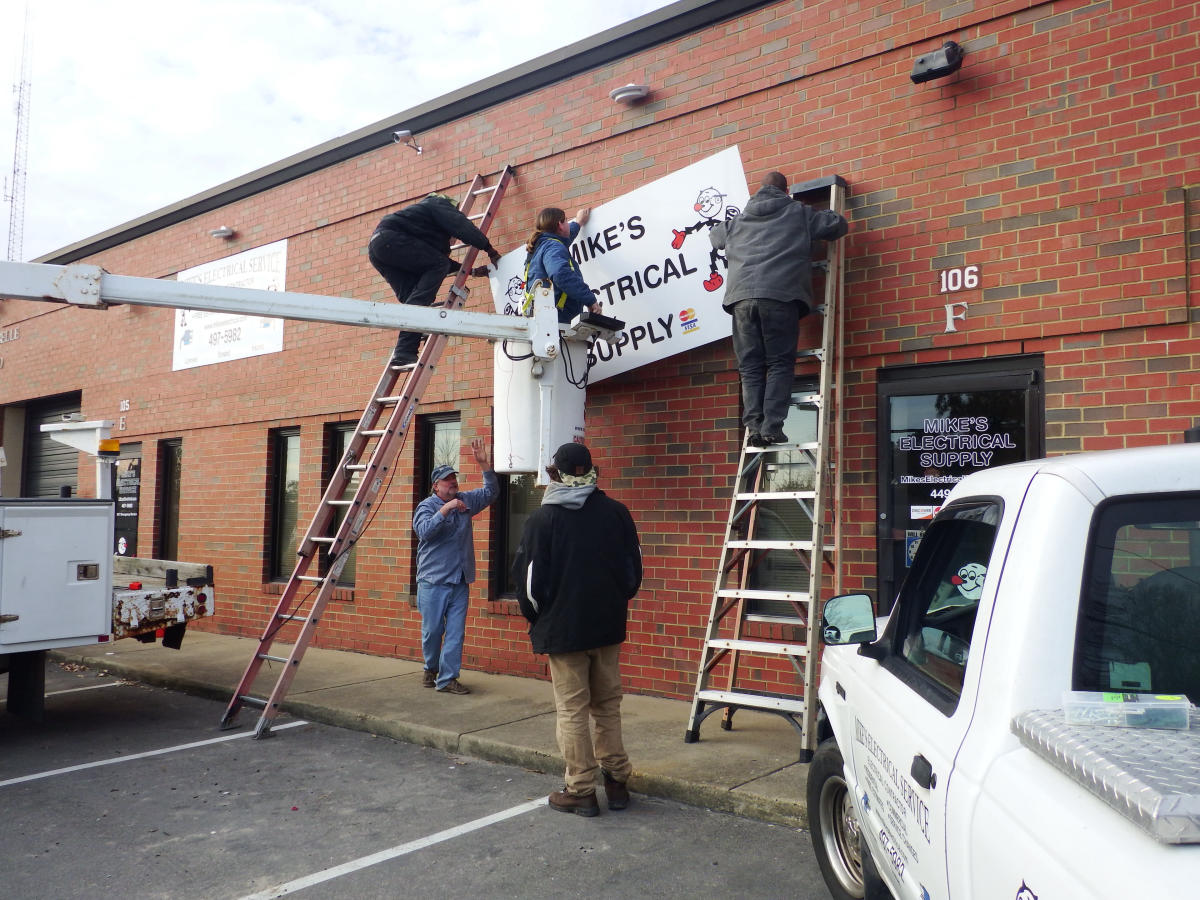 Sign installation crew with bucket truck — Virginia Beach
